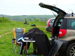 Andrew M1CJE operating under a cloth for sun protection.