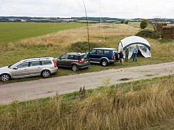 Our main operating shelter with outside l-r the photographer Philip G3PPB, John G1OQV, Neil 2E0OQV, Bill M0TDW.