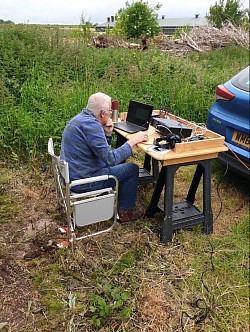 Bill M0TDW on the key outside our new shack.